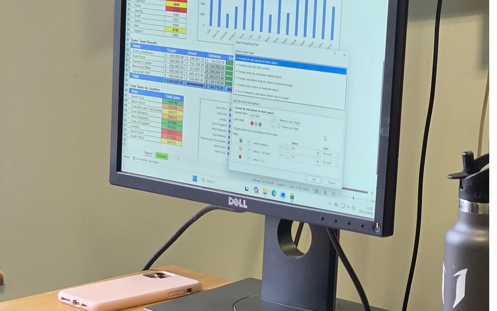 A monitor in a training room showing an Excel formatting rules dialog